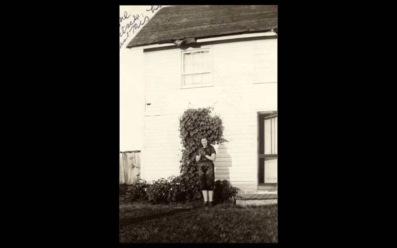 Jean, the Baseball Pitcher | Jean dressed in her high school baseball pitcher's uniform outside her Aunt Mi's house in Gentry County in the late 1930s.  (Courtesy of Jean JENNINGS Bartik Computing Museum)