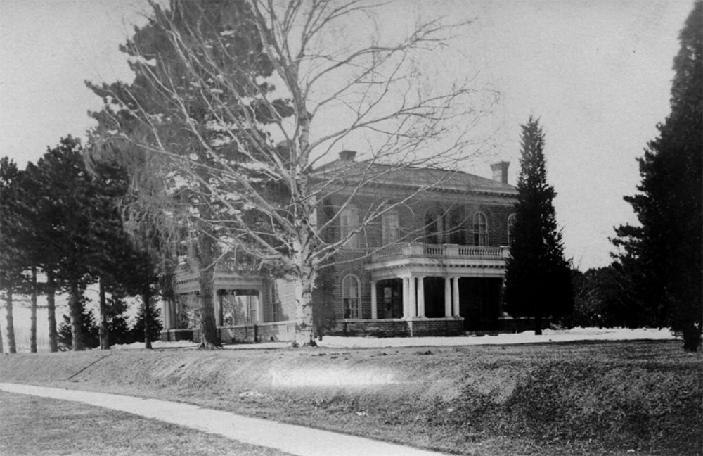 A 1910 postcard of the Gaunt House showcases the mature trees, sidewalk and east porch.