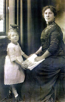 Cook's wife, Arrietta Morrill Cook, and daughter, Catherine, pose for a picture inside the Gaunt House.