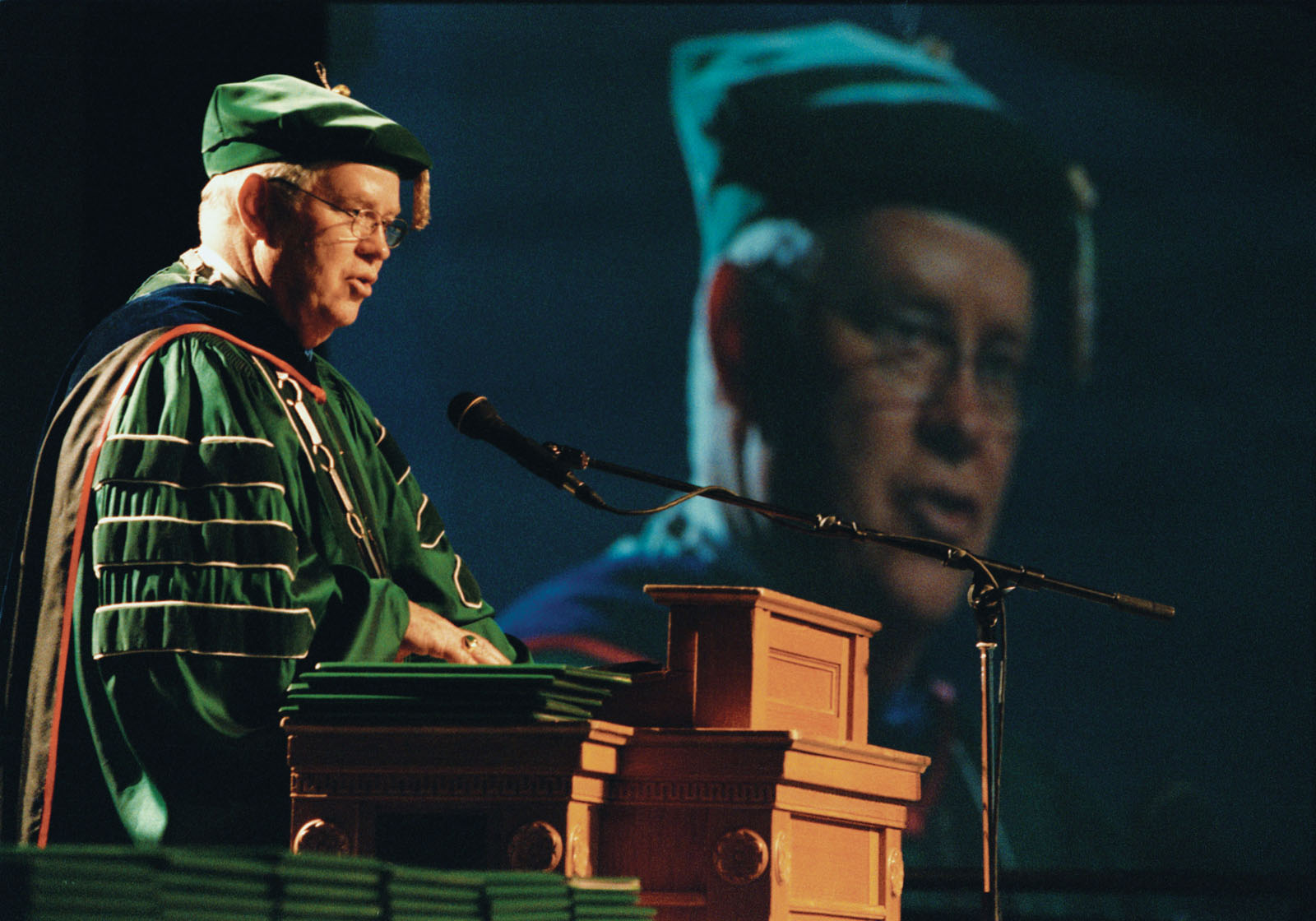 President Hubbard addresses graduates and their families during the December 2000 graduation ceremony in Bearcat Arena.