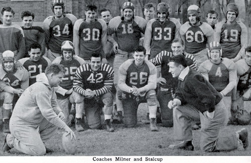 Head football coach Milner grins at his assistant coach, Wilber "Sparky" Stalcup.  During the basketball season, the men switched roles, as Stalcup was head basketball coach and Milner was the assistant coach.