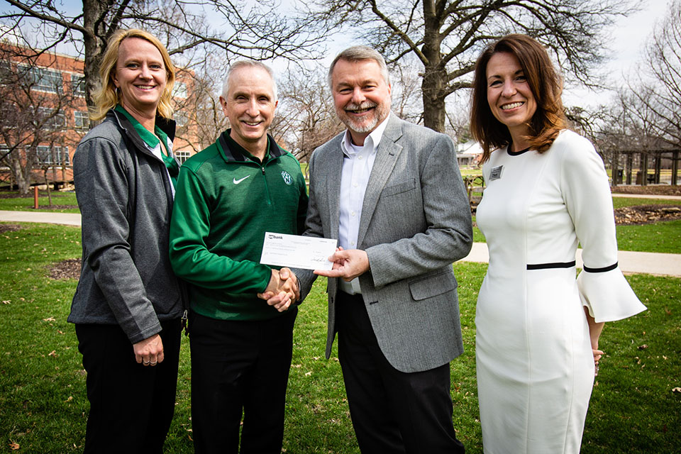 Representatives of U.S. Bank recently presented Northwest and the Northwest Foundation with a financial gift to support a planned Agricultural Learning Center. Pictured left to right are Mitzi Marchant, the director of donor engagement for the Northwest Foundation and Office of University Advancement; Northwest President Dr. John Jasinski; Rex Brod, market president for U.S. Bank; and Shannon Moore, wealth management regional manager for U.S. Bank. (Photo by Brandon Bland/Northwest Missouri State University)