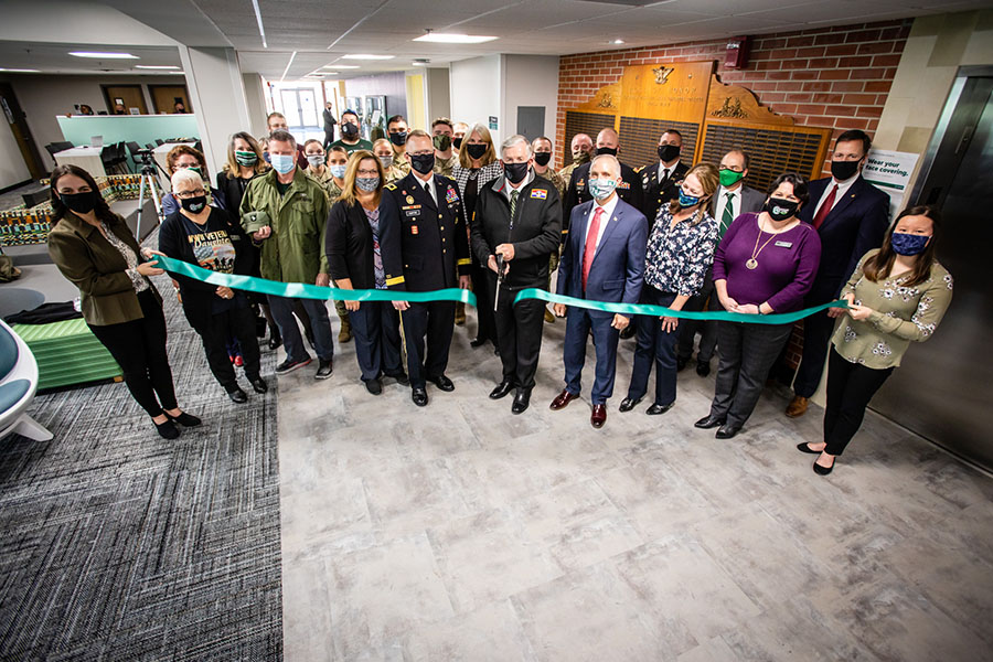 Missouri Gov. Mike Parson on Wednesday cut a ribbon dedicating the Veterans Commons on the top floor of Valk Center. He was joined in the photo by Northwest and state leaders and representatives of Northwest's Missouri GOLD program. (Photos by Todd Weddle/Northwest Missouri State University)  