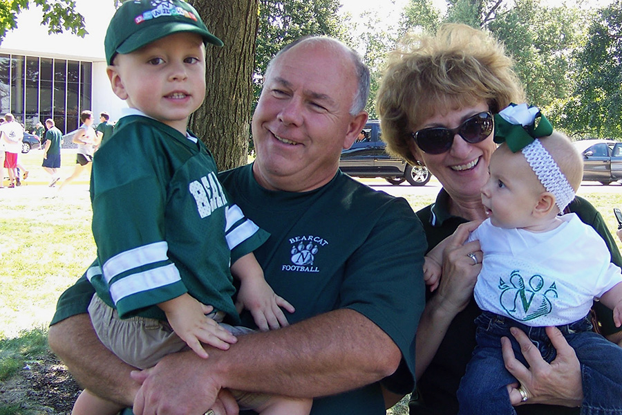 The Place family has maintained their strong connection with the University from Ted's parents, Chuck and Linda, to his children Ben and Claire, pictured at a Bearcat football tailgate in 2009.