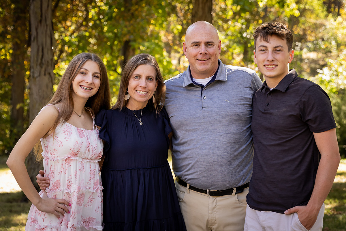 Ted with his wife, Kate, and their children, Claire and Ben. (Place family photo)
