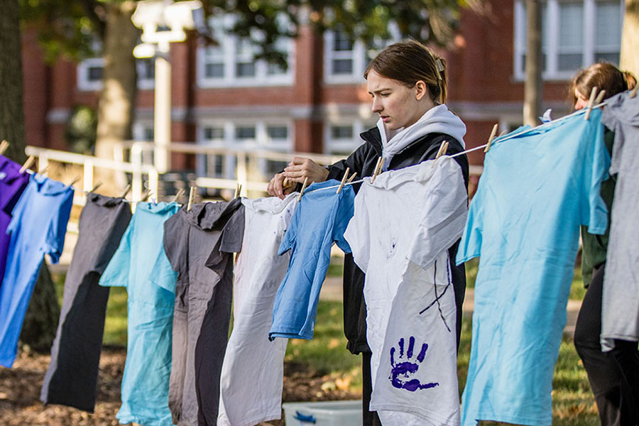 Courtney Rowe served as president of Northwest’s chapter of It’s On Us, a sexual assault awareness and prevention organization, and is pictured helping in 2022 with the Clothesline Project, a visual arts display to spread messages of violence prevention in conjunction with Domestic Violence Awareness Month. (Photo by Todd Weddle/Northwest Missouri State University)