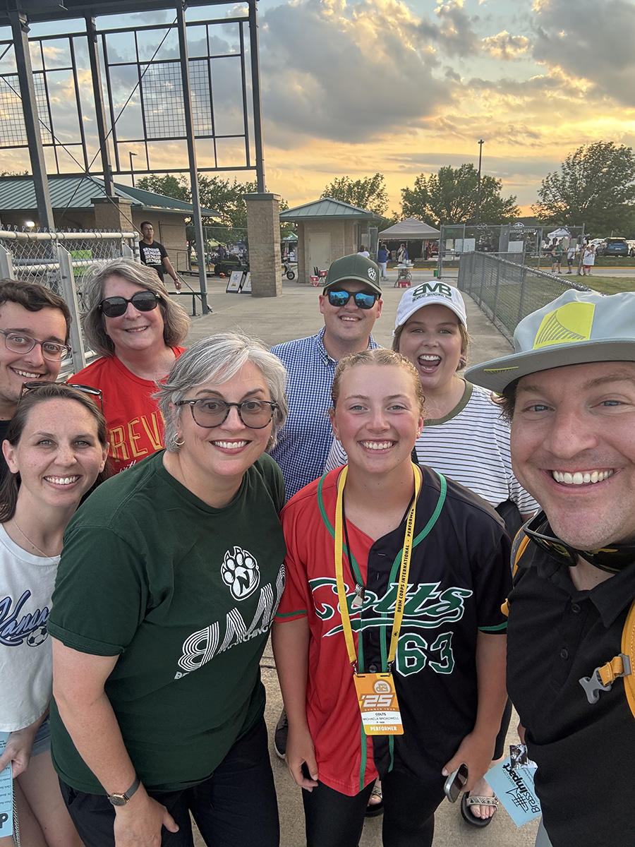 Michaela Broadwell, who spent her summer conducting the Colts drum corps, is pictured with Northwest faculty at a performance stop. (Submitted photo)