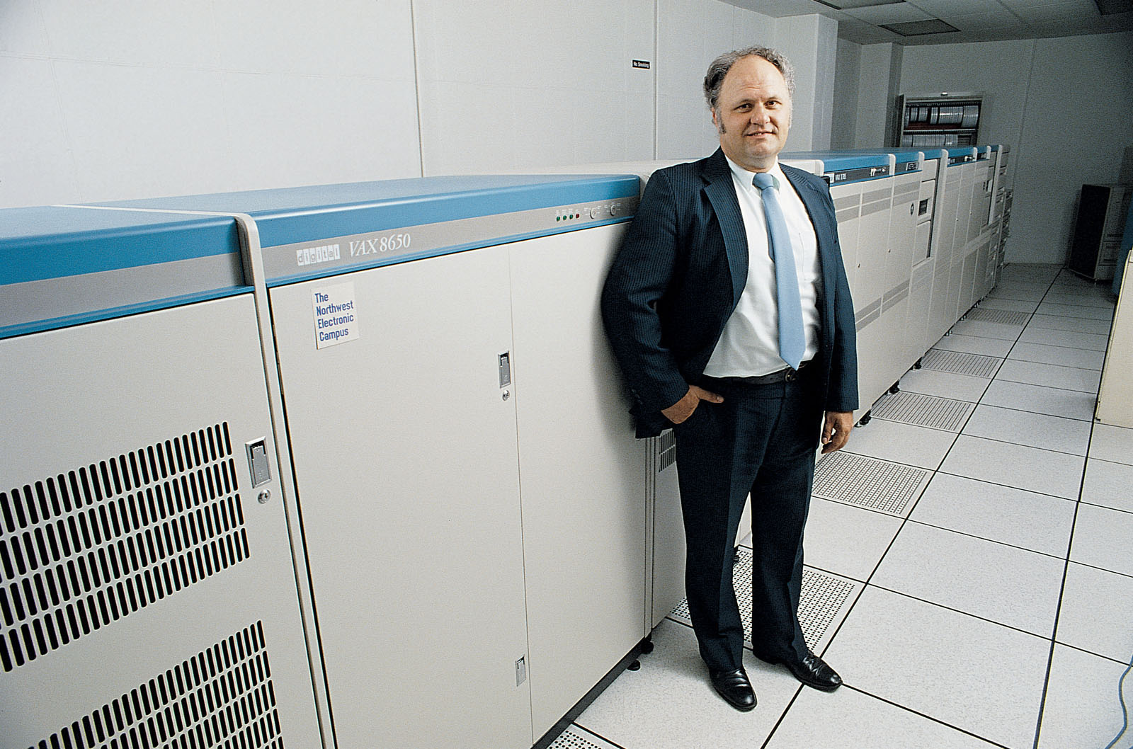 In 1984, Dr. Jon Rickman, who was then Northwest’s director of computer services and retired in 2011 as vice president of information systems after 35 years at the University, stands by the dual VAX in the B.D. Owens Library’s computing Center.