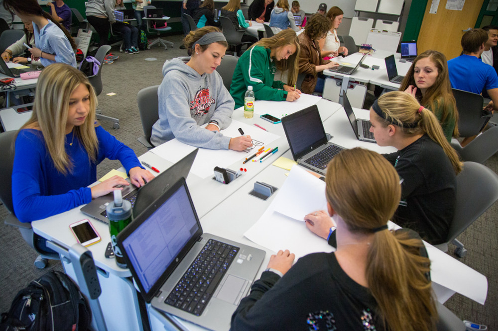Students use their Northwest laptops while taking advantage of the technology available in a new “model classroom” in Colden Hall in this 2015 photo. 