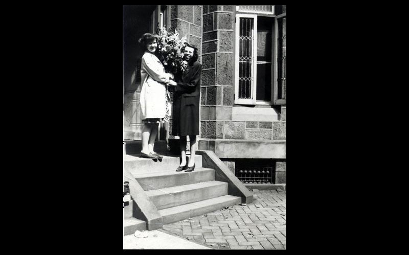 Jean Receives Birthday Flowers | Jean and a fellow "computer" from Kansas outside Jean's apartment at 2317 Delancy Place in Philadelphia, PA. (Courtesy of Jean JENNINGS Bartik Computing Museum)