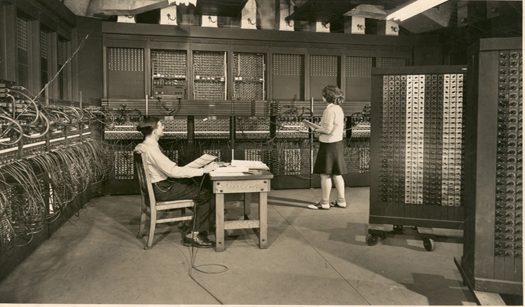 Jean & Arthur Burks | Jean programs ENIAC with the assistance of Senior Engineer Arthur Burks, 1946. (Image originally appeared in Science Illustrated in 1946.  The image was given to Jean Jennings Bartik in 1946, who in turn (along with her neice Diane Passmore) gifted it to The Jean Jennings Bartik Computing Museum in 2002. The Bartik Museum has the only known (at this time) existing original print of this image. All rights served).