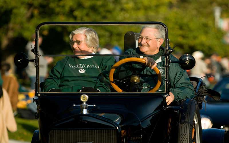 Jean as Homecoming Grand Marshall  | Jean Jennings Bartik rides at the head of the 2007 Homecoming Parade as Grand Marshall with Republican State Representative from Nodaway County, Mike Thomson. (Courtesy of Northwest Missouri State University's Photographer Darren Whitley.)
