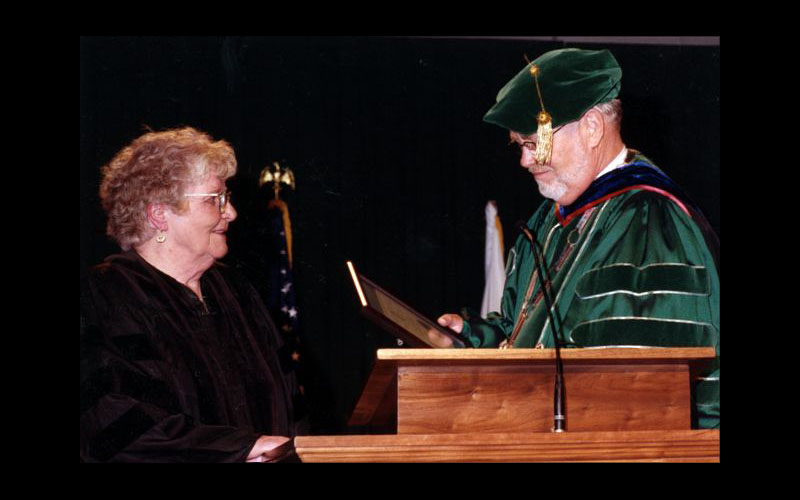 Jean Receives Honorary Doctorate | Dr. Dean Hubbard, president of Northwest Missouri State University, presents Jean Jennings Bartik with an Honorary Doctor of Science Degree. Jean graduated from Northwest in 1945 with a degree in Mathematics. (Courtesy of Jean JENNINGS Bartik Computing Museum)