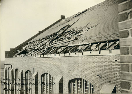 The tornado, which destroyed the Green House, also tore off a portion of the Administration Building roof.