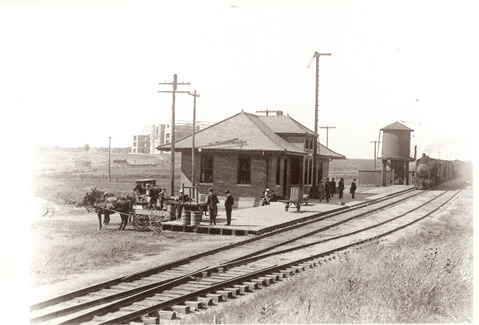 The Wabash Train Depot with the new Fifth District Normal School in the background. Maryville's two railroads helped provide a tangible inducement to the State Normal School Committee.