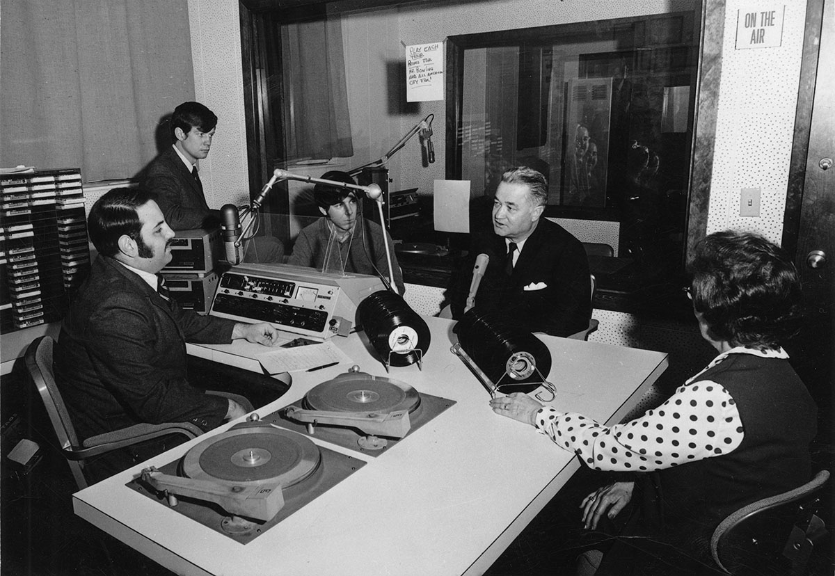 Robert Foster, who was instrumental in pushing for enhancements to Northwest's radio broadcast studios, talks with KDLX staff members in 1970.