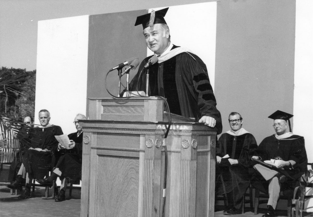 Robert Foster speaks at a commencement ceremony.