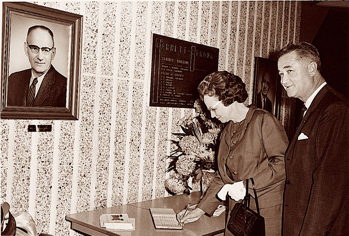 President Foster and his wife, Virginia, sign the guest book at the dedication of the Garrett-Strong Science Building in 1968,