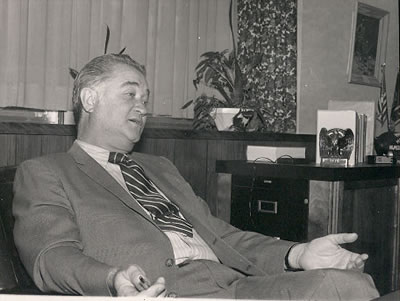 Dr. Foster sits in his office in the Administration Building.  Dr. Foster oversaw many expansions on campus, such as the high-rise residence halls.  The Memorial Bell Tower was also the brainchild of Dr. Foster, who wanted a lasting memorial to the men and women who had served in World War II.  Dr. Foster's Bell Tower efforts resulted in the formation of the Northwest Foundation.