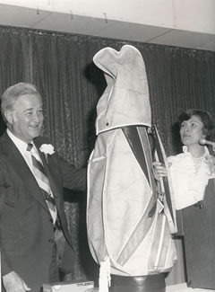 An avid golfer, Dr. Foster poses with his retirement gift at a dinner in his honor in 1977.  One of Dr. Foster's most significant achievements at Northwest was his leading role in securing funding for the establishment of KXCV/KRNW Radio, the University's 100,000-watt public radio station.  KXCV/KRNW Radio established the annual and much anticipated Robert Foster Golf Classic in his honor.
