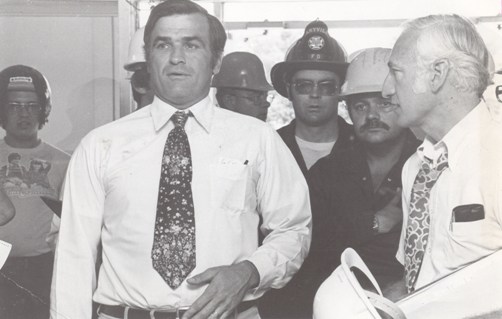 President Owens tours the Administration Building with Gov. Joe Teasdale two days after the fire that nearly destroyed the historic structure in 1979. Owens ably led Northwest through one of its worst disasters with determination. Under his leadership, the Administration Building was restored and the university library, constructed as a result of the disaster, was named in his honor when he retired in 1984.