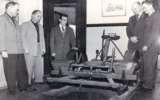 President Bob Foster views antique farming equipment once used on campus at the Northwest Farm.