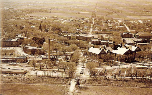 An aerial view of the Northwest campus from the north side in 1960, featuring the new gymnasium, Colden Hall, new residence halls and veterans' housing.