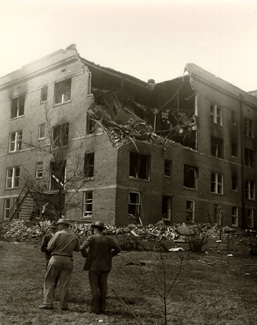 Officials survey the damage to the Women's Residence Hall after the blast.