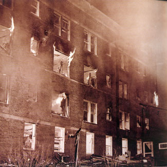 Women's Residence Hall on fire after explosion, which caused the death of Roberta Steel.  April 28, 1951.