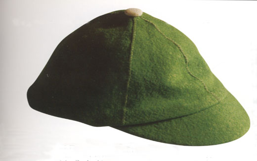 The green beanie was worn by freshman students during the 1950s to indicate their "new" status.  Walk-Out Day signaled the end of having to wear the beanies.