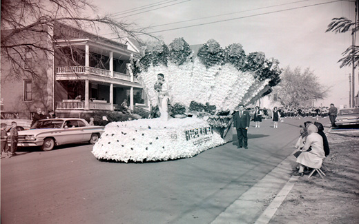 A detailed Native American float glides down a Maryville street during the 1962 Northwest Homecoming Parade.
