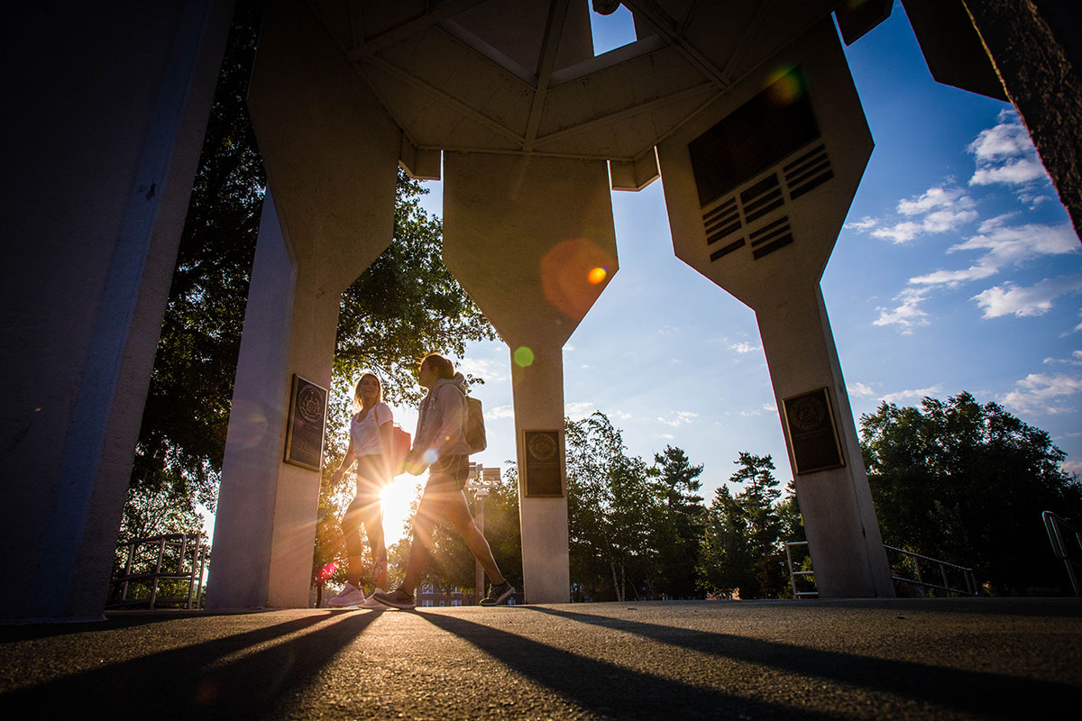 Students walk under the Memorial Bell Tower on the first day of fall classes in 2018.