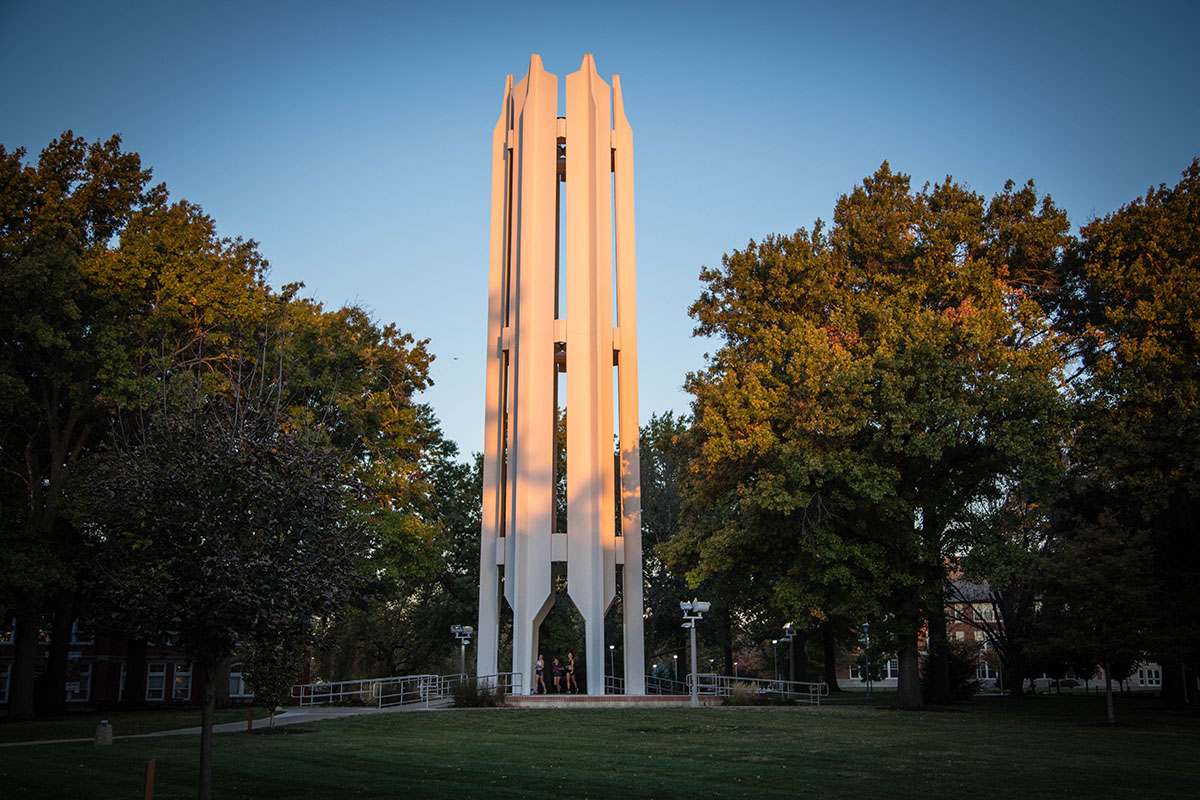 The rising sun bounces off the Memorial Bell Tower on an October morning.