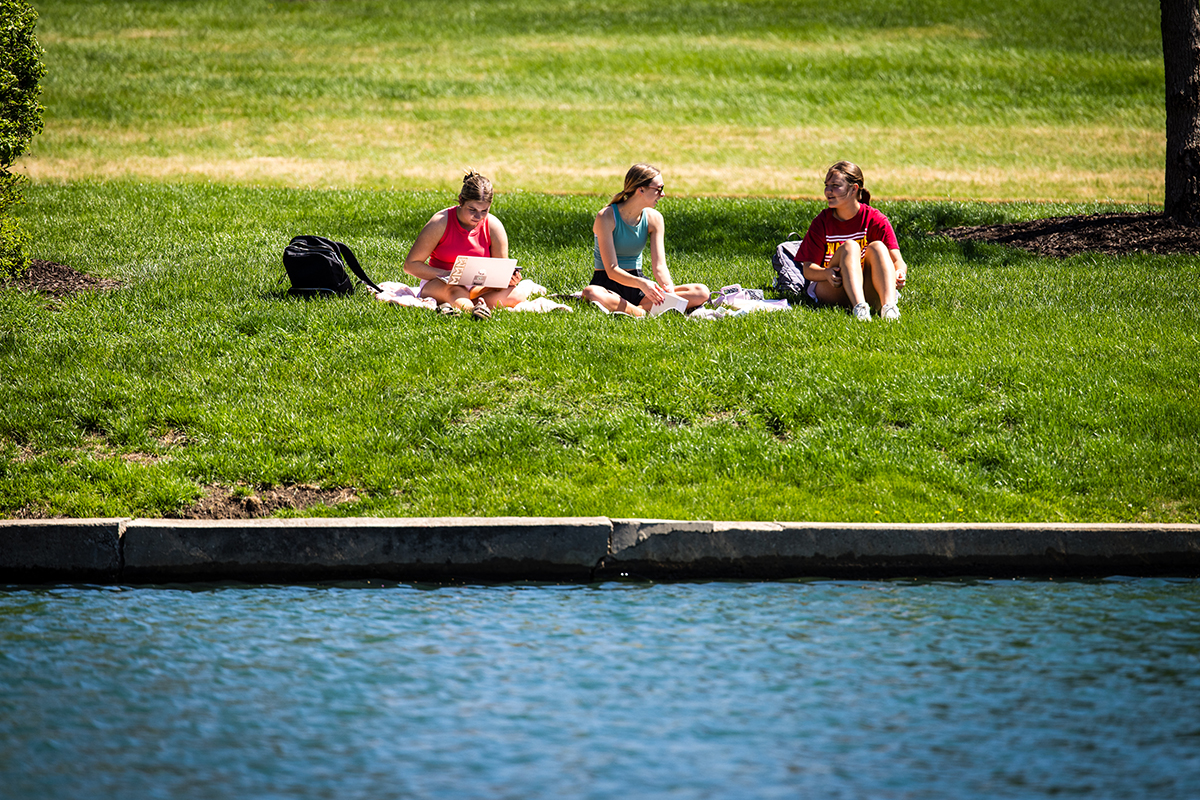 Northwest students enjoy studying and socializing alongside Colden Pond. Colden Pond is located on the south edge of the Northwest campus, adjacent to Colden Hall. (Photo by Lilly Cook | Northwest Missouri State University)