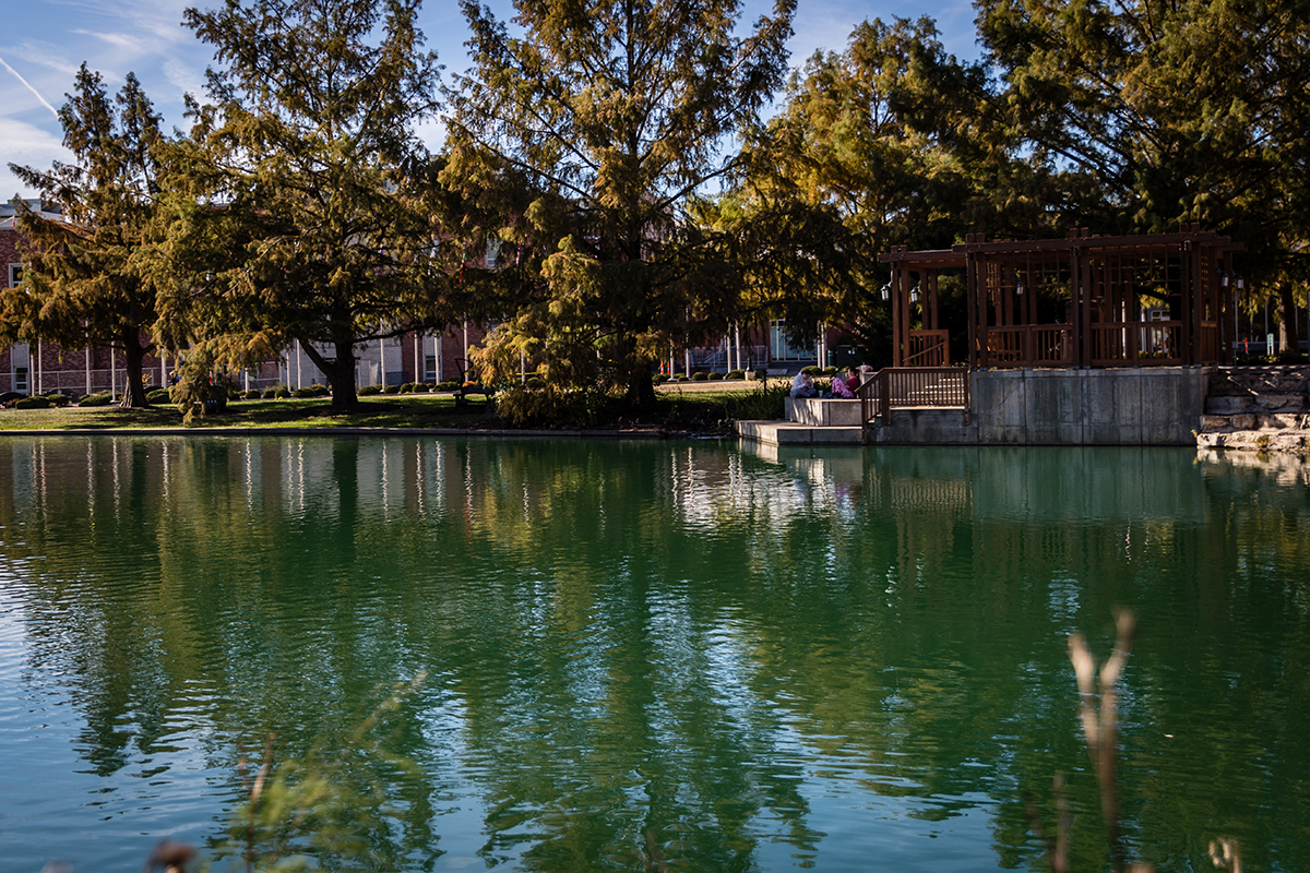 Trees surrounding Colden Pond are reflected in the water. (Photo by Chloe Timmons | Northwest Missouri State University)