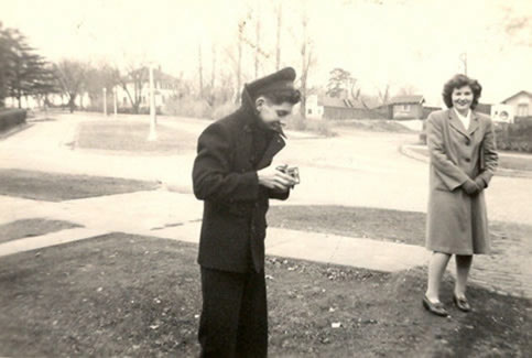 President Uel Lamkin was able to get the Navy V-12 and V-5 training programs at Northwest.  Northwest 1945 graduate and computing pioneer, Jean Jennings Bartik, stands outside her Maryville residence on 4th Street chatting with one of the men in the Navy V-12 program.