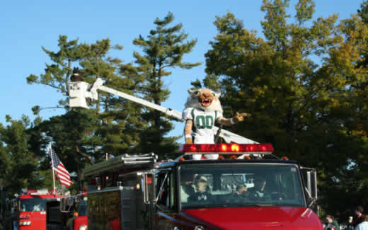 Bobby rides on a fire truck during the 2007 Northwest Homecoming Parade.  Jake Phillips was Bobby from 2003 to 2006 and Bryan Williams was Bobby in the parades from 2008 to 2009.