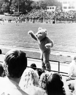 Bobby helps with school spirit during a 1977 football game, urging the crowd to cheer for the Bearcats.