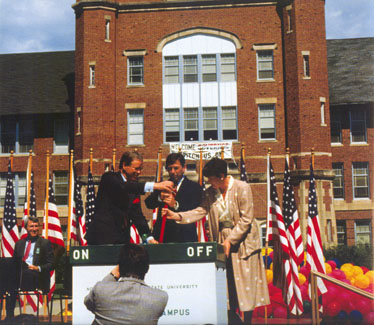 Northwest President Dean Hubbard, Missouri Governor John Ashcroft and President of the Maryville Chamber of Commerce, Kay Wilson, ceremonially switch on the Electronic Campus on August 18, 1987.  Northwest became the first "electronic campus" in the nation.