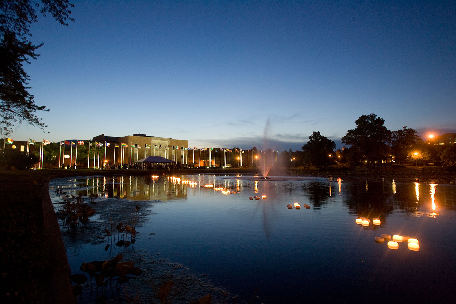 The International Plaza, seen here at night from across Colden Pond, was completed entirely through $400,000 in donations, with the most generous donation from Joyce and Harvey White, a couple with long-standing ties to Northwest.