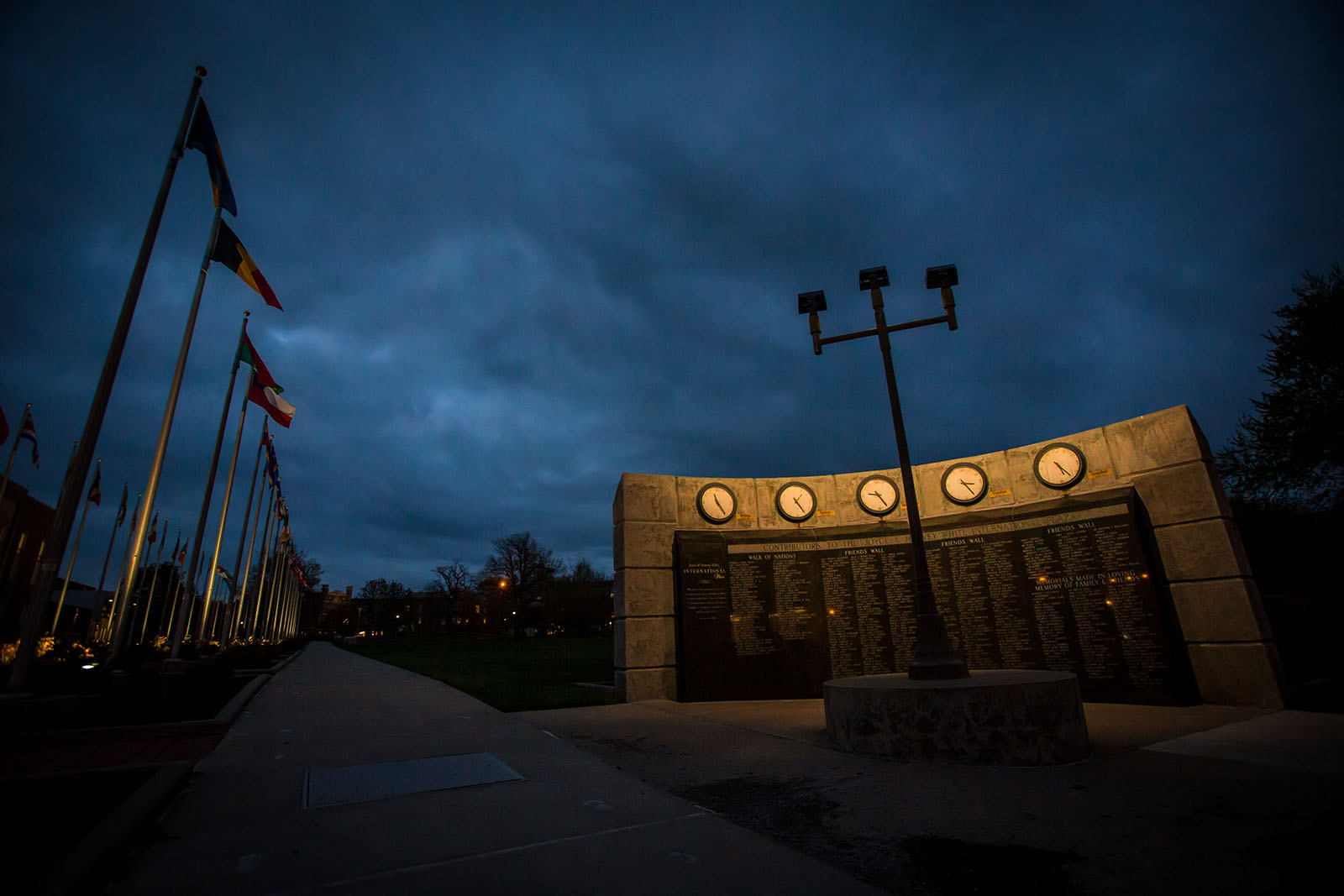 The “Friends Wall & World Clock” stands at the southern end of the Joyce and Harvey White International Plaza. The granite wall displays the names of alumni and friends who helped fund and support the International Plaza project.