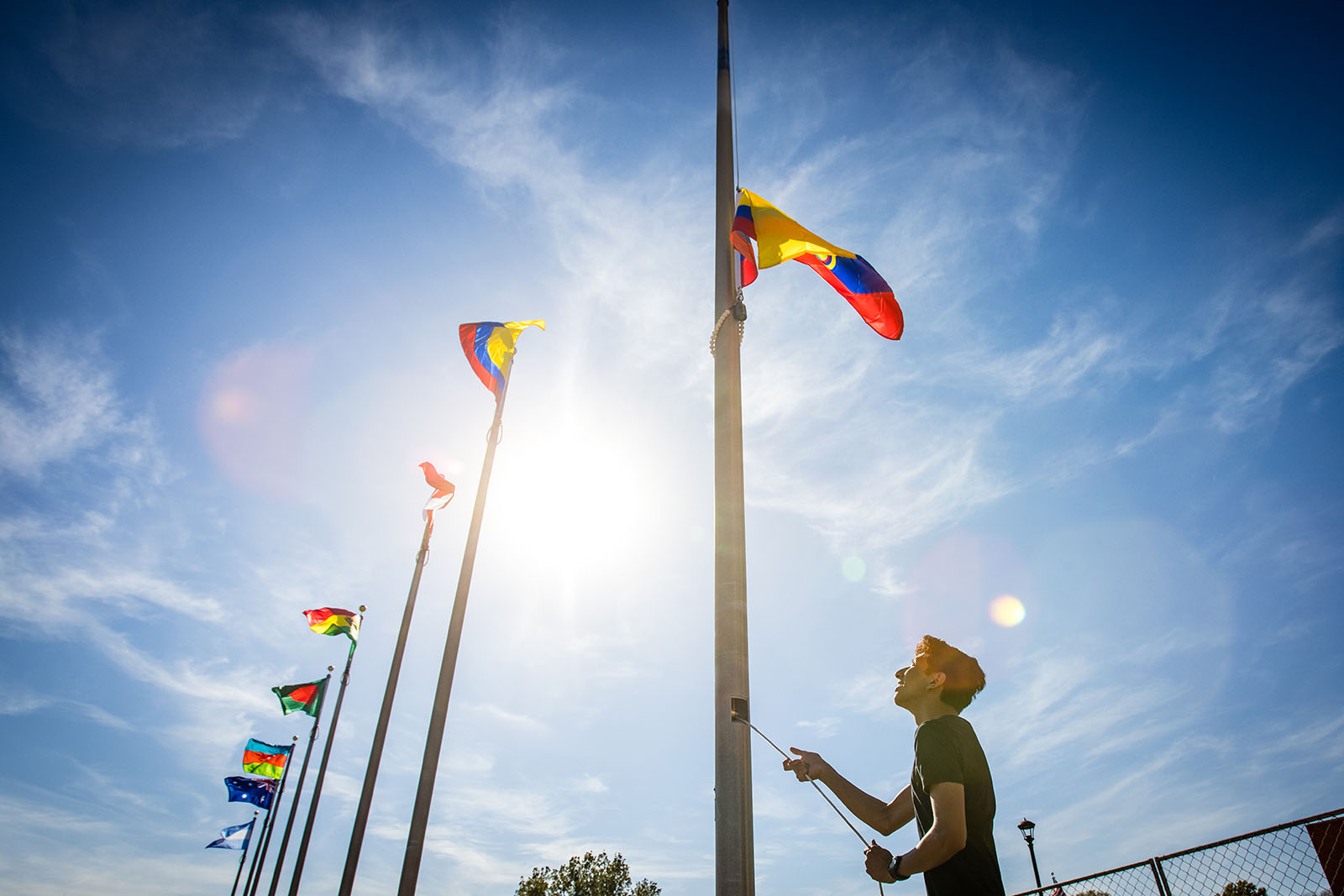 Northwest international students participate in a flag-raising ceremony during Homecoming activities each fall to celebrate their homelands and cultures as well the University’s diversity. 