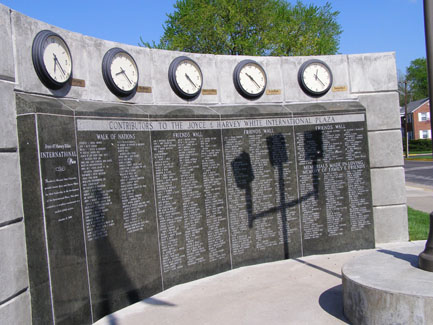 The "Friends Wall & World Clock" stands next to the Boulevard of Nations. The granite wall displays the names of alumni and friends who donated to the International Plaza project.