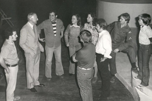 President Owens talks with student theater majors on the stage at the Charles Johnson Theater in the Olive DeLuce Fine Arts Building.