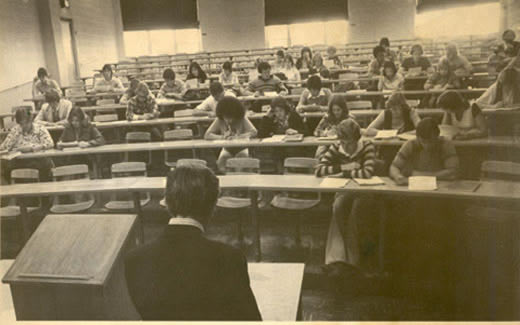 Students listen to Professor Dr. William Fleming in one of the lecture rooms in Colden Hall during the 1970s.