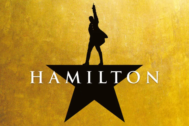 Hamilton logo on a yellow background. The logo consists of the silhouette of a man standing on top of a star