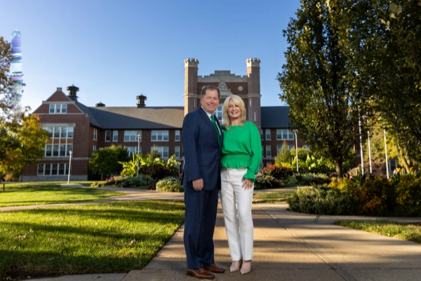 Official Portrait of President Tatum and the First Lady in front of the Administration Building