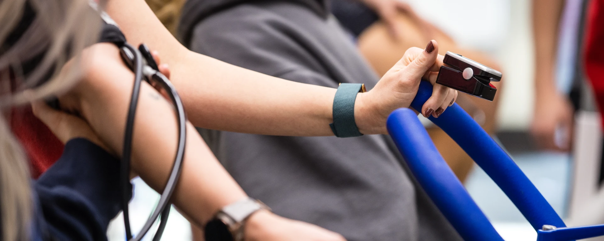 Close-up of public health worker taking vitals during an exercise testing