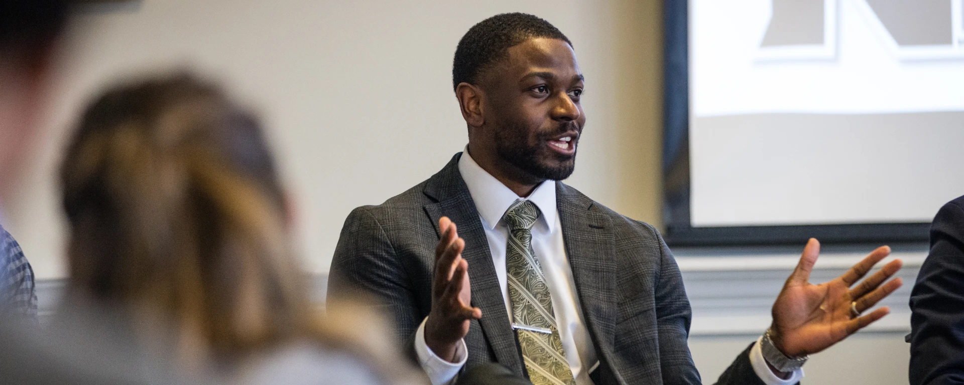 A guest speaks at School of Business' Meet the Pros event featuring marketing and management professionals