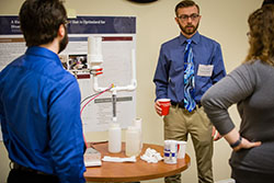 Connor McNeil discussed the hypochlorite reactor he designed and constructed with Him Shreshtha as part of an undergraduate research project. McNeil and Shreshtha were among the award winners at last year's Celebration of Quality.